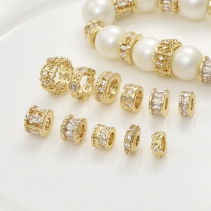 Macro detail of 14k gold plated spacer beads with zircon inlays for DIY jewelry making