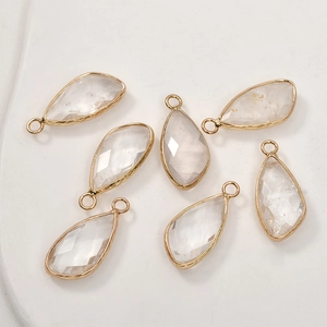 Detail of seven pear-shaped faceted crystal pendants with gold-plated metal edges
