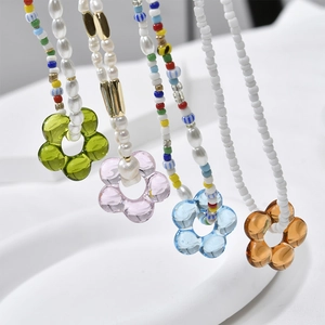 Handmade beaded necklaces with transparent hollow flower pendants in pastel colors