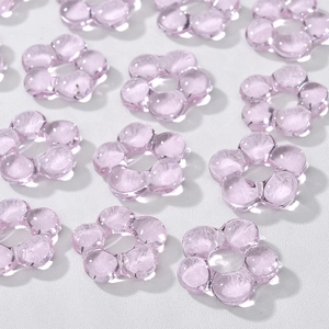 Detailed view of light purple transparent glass flower beads for DIY jewelry making