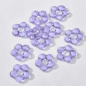 Macro view of lavender translucent hollow flower beads for DIY jewelry making and crafts