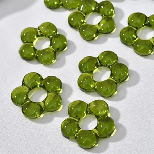 Macro detail of grass green translucent glass flower beads for DIY jewelry making