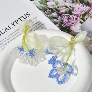 Detail of handmade chiffon bow and crystal flower charm for DIY earring jewelry making