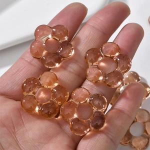 Macro shot of amber hollow glass flower bead for handmade jewelry and DIY crafts