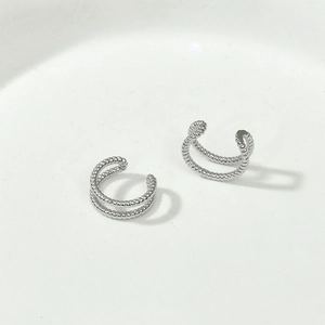 Close-up of silver-toned double layer twisted ear cuffs for non-pierced ears