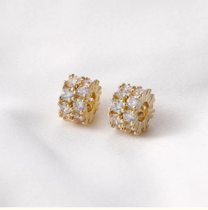 Detailed macro of 14k gold plated barrel bead with sparkling cubic zirconia pavé stones