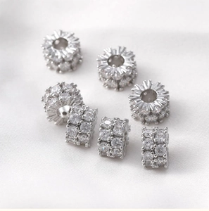 Macro view of 14k gold-filled beads with zircon pavé for DIY jewelry necklaces
