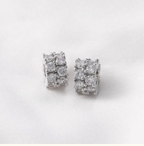 Macro shot of silver pavé hoop earrings with two rows of brilliant-cut cubic zirconia