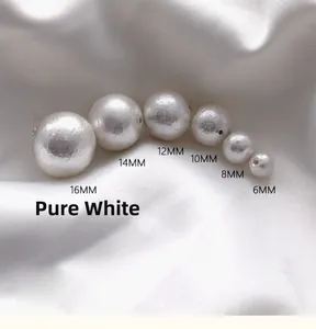Detailed view of pure white cotton pearls in various sizes from 6mm to 16mm