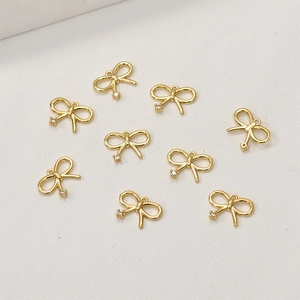 Neun 14k vergoldete Schleifenanhänger mit Zirkonia-Einlage für DIY-Schmuckherstellung
