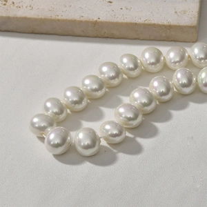 Close-up of white pearls with iridescent luster on stone for DIY jewelry making