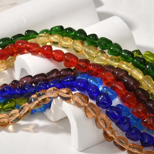 Macro shot of colorful baroque glass beads for DIY jewelry making with smooth finish