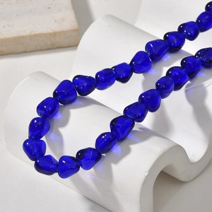 Macro detail of irregular dark blue baroque glass beads for DIY jewelry making