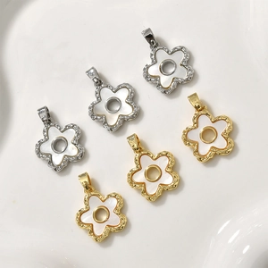 18k gold plated clover flower pendant with white shell inlay and hammered metal texture