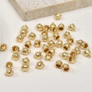 Detailed view of 14k gold-plated lily of the valley flower pendants for DIY jewelry making