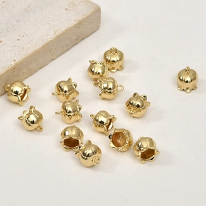 Close-up of 14k gold plated lily of the valley pendants for DIY jewelry making