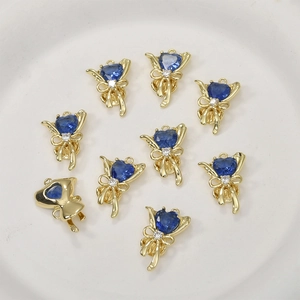 Pendentifs cœur dorés avec zircon bleu et nœud pour la création de bijoux DIY élégants
