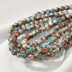 Macro detail of 8mm colorful sediment stone beads with natural texture for jewelry making