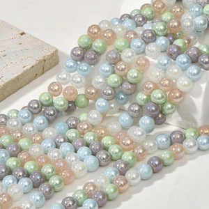 Macro view of 8mm iridescent glass round beads with aurora luster for DIY jewelry