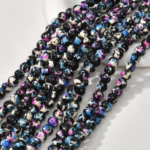 Detailed macro view of 8mm oil painting style turquoise beads with colorful ink patterns