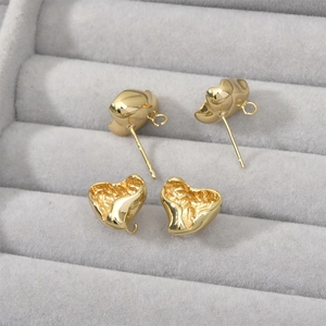 Detailed view of 14k gold-plated lava heart ear studs for DIY jewelry making