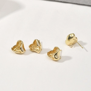 Detailed view of 14k gold plated heart earrings with irregular lava texture for DIY