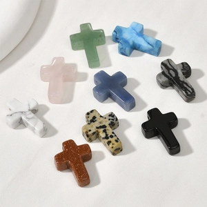 Macro view of natural stone cross pendants for DIY jewelry making in various materials