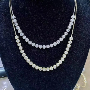 Adjustable silver and gold tennis necklaces with round bezel set cubic zirconia crystals