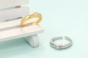 Adjustable open rings in gold and silver finish with pear-cut zircon teardrop stones