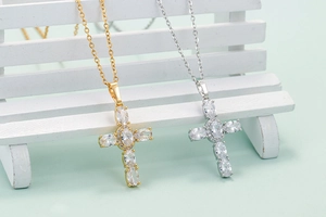 Hip hop style cross pendant necklace with oval cubic zirconia in gold and silver finish