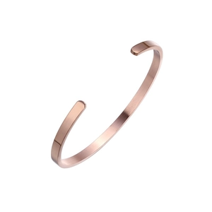 Minimalist rose gold open cuff bracelet with a brushed metal finish and C-shape design