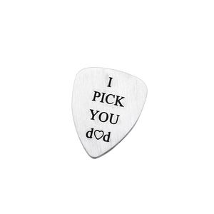 Polished titanium steel guitar pick with 'I PICK YOU DAD' engraving on white background