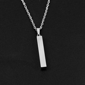 Close-up of a silver vertical bar pendant necklace with a brushed steel finish and link chain