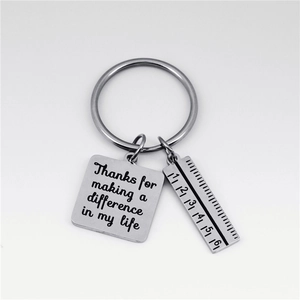 Stainless steel keychain with ruler charm and Thanks for making a difference engraving