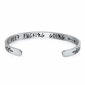 Polished silver C-shaped stainless steel cuff bracelet with Keep Fucking Going engraving