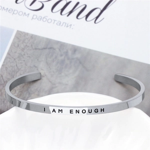 Minimalist silver-tone C-shaped stainless steel bracelet with I AM ENOUGH engraving