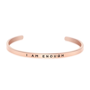 Minimalist rose gold cuff bracelet with engraved I AM ENOUGH lettering on brushed metal