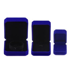 Three-piece royal blue velvet jewelry gift box set for rings and necklaces on white background