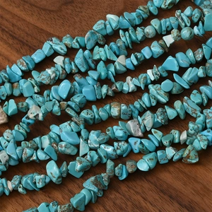 Close-up of natural irregular turquoise chip beads with brown mineral veins for DIY jewelry
