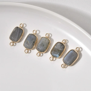 Detail of faceted rectangular labradorite stone connectors with gold plated edges