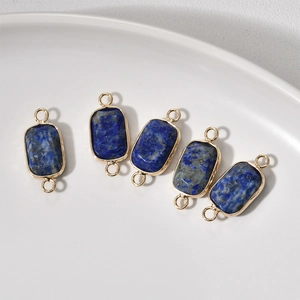 Detailed view of rectangular lapis lazuli connectors with gold borders for DIY jewelry