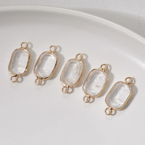 Five rectangular clear crystal stone connectors with gold-plated trim for DIY jewelry