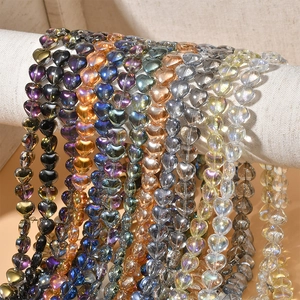 Close-up of colorful heart-shaped crystal glass beads for DIY jewelry making and crafts