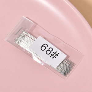 Macro shot of ultra-fine silver beading needles in 68# size for DIY jewelry making