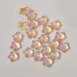 Vue macro de perles en forme d'étoile aurore pêche pour accessoires de bijoux DIY