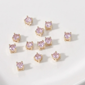 Cuentas de circonita rosa con base de cuatro garras dorada para creación de joyas