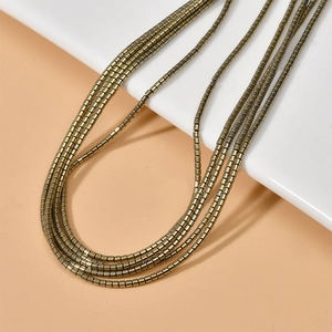 Dettaglio di perline in ematite a cilindro 2mm in oro vintage per gioielli DIY