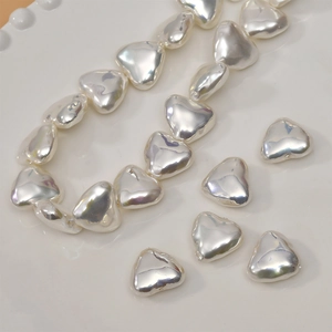Macro view of heart-shaped baroque pearl beads for DIY jewelry making and craft