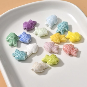 Handmade fish shaped ceramic beads in colorful macaron tones for DIY jewelry making