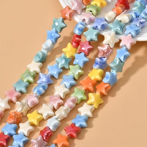 Macro detail of multi-colored ceramic star beads with glossy glazed finish for DIY jewelry